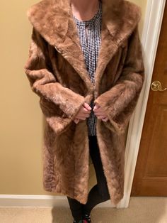 Super stunning fur jacket made by Furs of Perlstein in Chicago. Super pretty interior design as well. Has only one button (not missing any, just only has a middle button). In great condition. Model is 5'2 and 115 pounds and it's a bit loose and long in the arm section. Formal Faux Fur Outerwear In Mink Color, Classic Mink Faux Fur Coat, Formal Mink Outerwear With Faux Fur Lining, Classic Mink-colored Faux Fur Coat, Classic Mink Color Faux Fur Coat, Vintage Formal Fur Coat With Faux Fur Trim, Classic Mink Outerwear With Faux Fur Lining, Vintage Fur Coat For Winter Formal, Vintage Winter Fur Coat For Formal Occasions