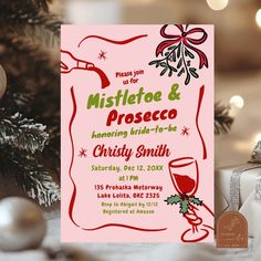 a pink christmas party card with a wine glass and mistlet & prosceco on it