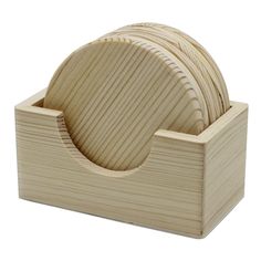 a set of four wooden coasters in a holder