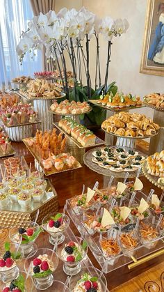 a table filled with lots of desserts and pastries