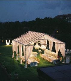 an outdoor wedding venue set up at night