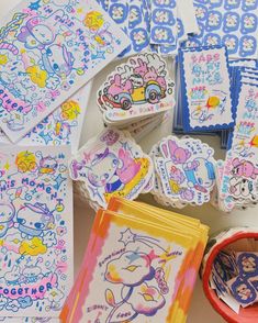 several different types of stickers on a table with scissors and other crafting supplies