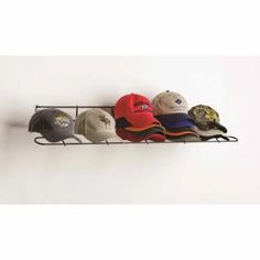 hat rack with five hats hanging on it