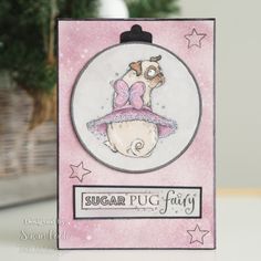 a card with a pug wearing a pink hat and bow on it's head