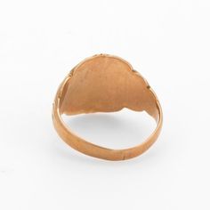 This is part of Chairish’s Fine Jewelry assortment.  Lovely antique Victorian signet ring (circa 1880s to 1900s), crafted in 10 karat rose gold.   The centre oval is inscribed yet due to wear we are unable to decipher the letters.   The side shoulders feature a pretty swirling design that terminates to the oval mount. The saddle of the ring is low and allows the ring to sit flat on the finger.     The ring is in good condition with patina and wear evident. We tend not to clean our antique pieces Victorian Engraved Ring With Rose Cut Diamonds, Antique Oval Engraved Ring With Rose Cut Diamonds, Victorian Oval Engraved Ring With Rose Cut Diamonds, Victorian 14k Gold Engraved Ring, Victorian Engraved Oval Ring, Victorian Oval Engraved Ring, Victorian Style Engraved 14k Rose Gold Ring, Oval Wedding Signet Ring With Maker's Mark, Victorian Rose Gold Hallmarked Ring