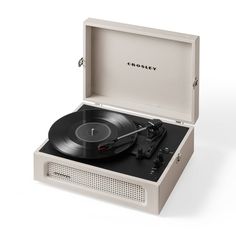 an old - fashioned record player is shown with its case open to reveal the vinyl