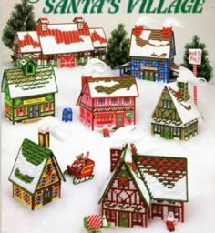 an advertisement for santa's village with small houses and sleighs in the snow