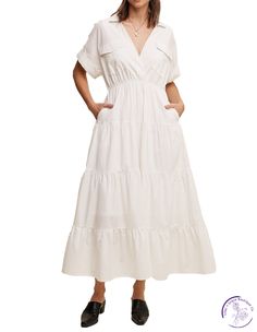 Feel effortlessly chic in our Collared Poplin Maxi Dress! The surplice neckline and tiered skirt add a touch of elegance, while the elastic waist and hidden side pockets provide practicality. With a lined design and clean hem, this dress is perfect for any occasion. Embrace comfort and style in this must-have dress! Material: 100% Cotton Chic White V-neck Tiered Dress, White V-neck Tiered Casual Dress, Elegant Tiered Skirt Dress With Gathered Waist, Elegant Dress With Gathered Waist And Tiered Skirt, Chic Cotton Tiered Dress, Elegant Tiered Cotton Midi Dress, White V-neck Midi Dress With Pockets, Spring Tiered Dress With Pockets, Chic White Tiered Dress With V-neck