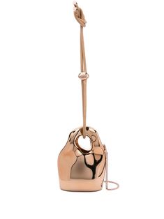 bronze-tone polished finish stone-shaped metallic effect cut-out detailing knot detailing magnetic fastening leather strap adjustable sliding fastening detachable chain-link shoulder strap flat base main compartment Modern Gold Tote Bucket Bag, Modern Gold Bucket Bag For Evening, Modern Gold Top Handle Bucket Bag, Modern Gold Evening Bucket Bag, Metallic Leather Bag With Dust Bag Included, Gold Bucket Bag With Detachable Strap And Double Handle, Gold Double Handle Bucket Bag With Detachable Strap, Modern Gold Bucket Bag With Detachable Strap, Party Leather Bag With Glossy Finish