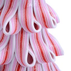 a pink and red striped christmas tree decoration