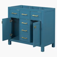 a blue cabinet with gold handles and drawers