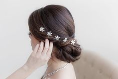 "These brilliant crystal and pearl snowflakes are perfect to add to your winter wedding, Christmas or holiday party, or any special occasion hairstyle. Measuring just over 3/4\", these sparkling snowflakes feature a swirl backing to \"twist\" into your hair for secure placement. Sold in sets of 6 twist ins. Choose from twist ins or hairpins. Orders are shipped via USPS with tracking and confirmation. Item arrives in a complimentary gift box. ------------------------------------------------------ Bridal Hair Twist, Snowflake Hair, Snowflake Wedding, Wedding Comb, Bridesmaid Attire, Special Occasion Hairstyles, Hair Twist, Wedding Winter, Wedding Hair Pins