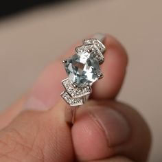 This is a gorgeous handmade creation. Its beauty is its simplicity & Elegance. The 7*7mm cushion cut faceted natural Aquamarine is crafted in solid sterling silver and with rhodium plated. All item is sent in a beautiful gift box If you have any idea of design your ring,pls contact me directly. You can realize more lovely stuff clicking the link https://www.etsy.com/shop/knightjewelry?refshopsection_shophome_leftnav Please leave the correct address and you phone number for delivering success Aquamarine Diamond Cut Ring, White Gold Blue Topaz Cushion Cut Ring, Silver Blue Topaz Cushion Cut Jewelry, Cushion Cut Blue Topaz Jewelry With Center Stone, Blue Topaz Cushion Cut Diamond Ring, Cushion Cut Aquamarine Gemstone Jewelry, Cushion Cut Blue Topaz Rings With Diamond Accents, Silver Cushion Cut Topaz Ring With Diamond Accents, Silver Topaz Ring With Cushion Cut And Accent Stones