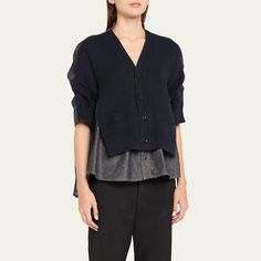 SACAI denim top with a cardigan overlay Stand-up collar; button front Elbow-length sleeves Relaxed fit Cotton/polyester Dry clean Made in Japan Spring Workwear Fake Two-piece Tops, Elbow Length Sleeve, Denim Top, Made In Japan, Stand Up, Tops Designs, Dry Clean, Relaxed Fit, Japan