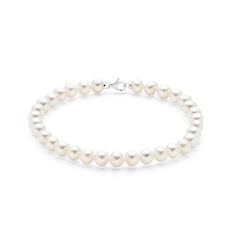 Elevate your jewelry collection with this luxurious freshwater pearl bracelet, featuring 6mm natural pearls and a stunning 18K white gold lobster clasp. The pearls’ larger size provides a bold yet elegant statement, making this bracelet perfect for both day and evening wear. The radiant white gold clasp adds a touch of sophistication, ensuring the bracelet stays securely in place. This piece is ideal for those who appreciate classic design with a modern twist. Treat yourself or a loved one to th Classic White Gold Pearl Bracelet With Oyster Clasp, Classic White Gold Pearl Bracelet With Oyster Details, Timeless White Gold Pearl Bracelet, Single Strand Akoya Pearl Bracelet In Pearl White, Akoya Pearl Charm Bracelet With Round Beads, Akoya Pearl Bracelet With Round Beads And Pearl Charm, Formal White Gold Pearl Bracelets, Formal White Gold Pearl Bracelet, Luxury Akoya Pearl Bracelet In White Gold