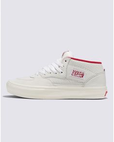 a pair of white sneakers with red accents