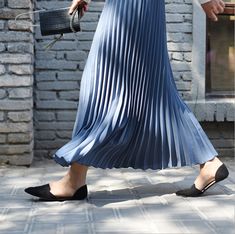 Exude elegance and class in our Solid Pleated Maxi Skirt. Featuring a long fit and elasticated waistband, this skirt is sure to keep you feeling comfortable and looking stylish all day long. Perfect for everyday wear, this versatile piece may be paired with a sweater or blouse for an effortlessly chic look to wear for casual days out or in formal settings. Casual Stretch Skirt With Accordion Pleats, Stretch Pleated Midi Skirt, Pleated Non-stretch Flared Maxi Skirt, Fitted Ankle-length Casual Maxi Skirt, Casual Fitted Ankle-length Maxi Skirt, Casual Ankle-length Lined Skirt, Fitted Casual Maxi Skirt With Pleated Hem, Non-stretch Pleated Full Maxi Skirt, Ankle-length Relaxed Skirt For Spring