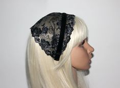 a white wig wearing a black lace headband