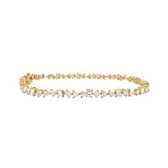 A untraditional take on a classic piece, the tennis bracelet. This iconic bracelet is crafted in a multi-shape scattered diamond style, featuring fancy-cut baguette, trillion, pear, oval, and round diamonds. An instant heirloom to wear and pass down for generations to come. 6.8GMS Solid 14K Gold and 4.45CT Diamonds Length: 7.25" Kimberley Certified Diamonds (Conflict Free) Luxury Wedding Bracelet With Marquise Cut, Luxury Wedding Bracelet, Marquise Cut, Luxury Marquise Cut Wedding Bracelets, Luxury Marquise Cut Wedding Bracelet, Luxury Wedding Diamond Bracelet With Marquise Cut, Luxury Marquise Cut Bracelets For Anniversary, Elegant Diamond Bracelet With Marquise Cut, Marquise Tennis Bracelet With Diamond Accents For Wedding, Marquise Diamond Accents Tennis Bracelet For Wedding