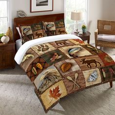 the comforter is made up with many different animals and leaves on it's bed