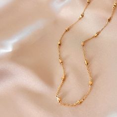 Our signature gold chain. Uniquely designed for layering over any necklace in our collection. Handmade, tarnish resistant 14k gold plated chain. Adjustable between 16"-18". Trendy Gold Plated Delicate Chain Layered Necklace, Rose Gold Plated Chain Necklace, Gold-plated Chain Necklace As A Gift, Gold Plated Chain Necklace For Gift, Trendy Gold-plated Necklace With Delicate Chain, 14k Gold-filled Cable Chain Necklace For Layering, Trendy Gold Plated Necklace With Delicate Chain, Gold Charm Necklace With Oval Link Chain, Gold Oval Link Chain Charm Necklace