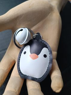 a key chain with a penguin on it