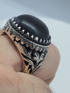 This is a Persian-styled vintage onyx mens ring set in 925 sterling silver and genuine black onyx. This gorgeous one-of-a-kind ring is intricately detailed. We have in a size 9.75, this can be sized to your specification, please message us to discuss sizing your ring or engraving options. All of our jewelry is hand polished and shipped to you in a stylish gift box. We are happy to gift wrap for you. It is important to us that each customer be thrilled with their purchase. We are grateful for tho Unique Black Round Signet Ring, Luxury Black Signet Ring Stamped 925, Unique Black Rings With Polished Finish, Unique Black Signet Ring For Anniversary, Antique Black Cabochon Rings, Unique Black Engraved Signet Ring, Unique Black Engraved Ring, Real Turquoise, Vintage Gothic