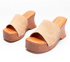 Anchored by a wooden wedge heel, these chunky clogs have a 70s fashionable flair. The metallic stud detail introduces an extra dose of attitude to the look. From Schutz. Trendy Summer Clogs With Wedge Heel, Trendy Summer Wedge Heel Clogs, Trendy Summer Clogs With Stacked Heel, Spring High Heel Clogs With Studded Rubber Outsoles, Trendy Mules With Wooden Wedge Heel, Summer Clogs With Stacked Wedge Heel, Trendy Beach Clogs With Wooden Heel, Trendy Clogs With Wooden Heel For Spring, Summer Wedge Clogs With Stacked Heel