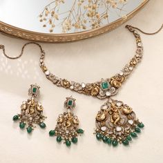 Description: This Victorian-plated Nakshi necklace and earring set is a stunning blend of elegance and artistry. The central element features Lord Krishna in exquisite detail, surrounded by a mesmerizing array of zircons and moissanites. The intricate design showcases ethereal craftsmanship, with each stone enhancing the divine presence of the central motif. Perfect for adding a touch of regal charm and spiritual grace to your traditional ensemble. Product Information: Materials used: 925 Silver Luxury Stone Work Jewelry Sets For Festive Occasion, Exquisite Hand Set Jewelry For Festive Occasions, Luxury Jewelry With Intricate Design For Diwali, Exquisite Diamond Necklace For Festive Occasions, Luxury Diamond Necklace For Reception With Intricate Design, Luxury Diwali Jewelry With Intricate Design, Luxury Festive Bridal Necklace With Intricate Design, Luxury Diamond Kundan Necklace Hand Set, Luxury Hand-set Diamond Kundan Necklace