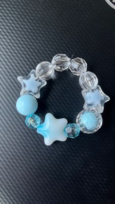 Blue star child size bracelet. Trendy Blue Star-shaped Jewelry, Trendy Star-shaped Blue Jewelry, Trendy Blue Star Shaped Jewelry, Blue Star Charm Bracelet, Blue Handmade Star-shaped Beaded Bracelets, Blue Beaded Bracelets With Star Charm For Gift, Handmade Blue Star-shaped Bracelet, Star-shaped Adjustable Crystal Bracelet, Blue Bracelet With Star Charm As Gift