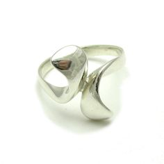 Sterling silver ring - R000252. Stamped 925. Approximate weight 4.4 grams. Top width 2.0 cm (0.80 inches). All our jewels are made from solid sterling silver 925/1000 and are carefully crafted by hand in our family workshop. We dispatch your orders in 5 working days, worldwide and the postage is $5. We ship registered priority mail. Please allow 5-7 working days for delivery in Europe and 10-15 working days outside Europe. For any questions - please do not hesitate to contact me! Sterling Silver Concave Ring Stamped 925, Modernist Sterling Silver Rings For Formal Occasions, Modern Hallmarked Sterling Silver Rings, Modern Silver Rings Hallmarked, Modern Sterling Silver Bypass Ring For Anniversary, Modern Hallmarked Silver Rings, Sterling Silver Concave Rings Hallmarked, Sterling Silver Concave Hallmarked Rings, Modern Sterling Silver Bypass Ring With Polished Finish