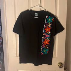 Size Medium. 100% Cotton. Hand Embroidered T-Shirt. Color Black. Will Bundle With Any Other Items In My Closet. Casual Black Shirt With Floral Embroidery, Black Embroidered T-shirt For Summer, Black Embroidered Cotton Shirt, Black Embroidered Crew Neck T-shirt, Black Floral Embroidery Crew Neck T-shirt, Black Embroidered Short Sleeve Shirt, Embroidered Black T-shirt For Spring, Black Cotton T-shirt With Custom Embroidery, Black Embroidered Summer T-shirt