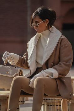 Experience sophistication and warmth in our Tan Presley Faux Leather Teddy Coat. Expertly crafted in a faux leather and sherpa combo, it features a shawl collar, long sleeves, and convenient side pockets with button front closures. Coordinate the full look with our Jenni Turtleneck Sweater Top. Oversize. Materials: (Coating) 100% Polyurethane (Fabric) 100% PolyesterLength: (full) 32 in. (sleeve) 24 in.Product Origin: ImportedWashing Instructions: Dry clean only Model is wearing size S Drop Sleeve, Faux Leather Coat, Teddy Coat, Full Look, Minimalist Wardrobe, Shawl Collar, Leather Coat, Shoulder Sleeve, Turtleneck Sweater