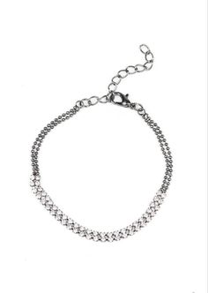 This edgy gunmetal custom choker set comes with a necklace and complimentary earrings, upgraded earrings, a clasp bracelet, and a ring with a stretchy back. Necklace - "What A Stunner": Featuring sleek fittings, dainty white rhinestones link with sections of glistening gunmetal chain around the neck. Shiny gunmetal beads dangle from the chain for a flirtatious finish. Features an adjustable clasp closure. Includes one pair of matching earrings. Upgraded earrings - "Fiercely Flauntable": Rows of Adjustable Edgy Sterling Silver Jewelry, Gunmetal Jewelry With Lobster Clasp In Metal, Edgy Silver Metal Body Jewelry, Adjustable Gunmetal Jewelry With Chain, Silver Metal Choker Body Jewelry, Trendy Adjustable Metal Body Jewelry, Adjustable Trendy Metal Body Jewelry, Adjustable Nickel Free Silver Body Jewelry, Dainty Adjustable Metal Body Jewelry