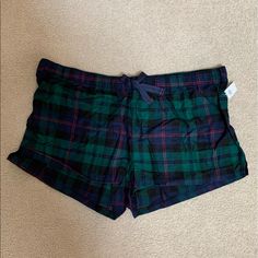 Old Navy Flannel Boxer Pajama Shorts. Green And Navy Plaid With Some Red. Elastic Waist With A Navy Ribbon Tie. Has About 1 Inch Slits On The Sides. Size Xxl. 100% Cotton. Green Pajama Shorts For Sleepover, Green Pajama Shorts For Sleep, Casual Plaid Short Sleepwear, Plaid Short Bottoms For Pajama Party, Plaid Shorts For Pajama Party, Plaid Pajama Shorts For Loungewear, Plaid Shorts For Loungewear, Flannel Shorts, Navy Ribbon