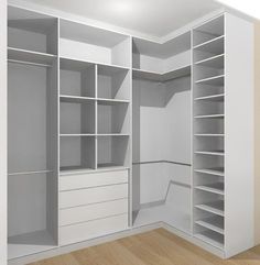 an empty white closet with shelves and drawers