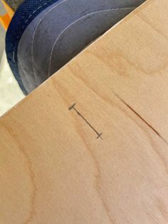 a close up of a person's feet on top of a piece of wood