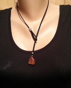 NECKLACES GEMSTONE HERE: https://www.etsy.com/shop/SofronKutStar?ref=seller-platform-mcnav§ion_id=32534750 *Material: Leather, stone pendant and silver plated beads. Carnelian is available in other models in our store: SHIPPING METHOD : Purchased item will be delivered by mail, will be sent via Priority Mail. Tracking number will be provided as soon as the items is shipped. * Delivery time can vary according to Your location. If you have any questions, please do not hesitate to contact me. Thank Adjustable Lariat Necklace With Natural Stones, Adjustable Lariat Jewelry With Natural Stones, Adjustable Gemstone Choker, Brown Necklace With Sliding Knot For Gift, Adjustable Spiritual Lariat Jewelry, Gemstone Lariat Long Necklace As A Gift, Adjustable Gemstone Dangle Necklace, Adjustable Gemstone Choker Necklace, Adjustable Crystal Necklace With Natural Stones