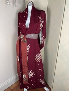 Silk crepe burgundy Japanese kimono with floral details and contrasting obi belt, fully lined in silk. One size fits most. Gothic Japanese Kimono, Elegant Red Kimono For Spring, Elegant Red Spring Kimono, Elegant Red Wrap Kimono, Formal Long Sleeve Kimono For Spring, Formal Long Sleeve Spring Kimono, Elegant Fitted Kimono With Floral Print, Formal Spring Kimono With Kimono Sleeves, Fitted Silk Kimono With Floral Print