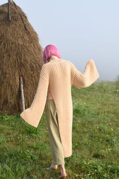 "Stylish asymmetric sweater with extra long wide sleeves. Made with soft wool blend yarn. Materials: Wool / Acrylic Color of the modeled sweater: honey Measurements (size S): Width (from underarm to underarm): 18,5\" = 46 cm Length: 46\" = 117 cm Sleeve length (shoulder to wrist): 26\" = 66 cm Measures of Model in the photo Size: S Chest: 32\" - 82 cm Weist: 24\" - 62 сm Hip: 34\" - 88 cm Height: 66\" - 170 cm CARE INSTRUCTIONS: DRY CLEAN is the best way. HAND WASH. Make sure to use cold water a Asymmetric Sweater, Maxi Sweater, Sweater Chunky, Asymmetrical Sweater, Womens Sweaters, Extra Long Sleeves, Long Knit, Cream Sweater, Wide Sleeves