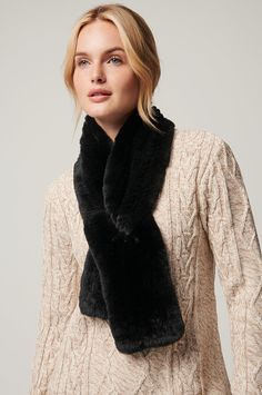 The magical softness of Rex rabbit fur manages the chill of winter. Our knitted Rex rabbit fur scarf adds luxurious texture to a cape or coat, while providing insulation from wind and chill. Wrap this scarf at the neck, and wear it outdoors or in. Or slide the end through the handy slip hole for a styled look that stays put. Elegant Winter Scarves For Cold Weather, Luxury Winter Scarves, Luxury Black Winter Scarves, Overland Accessories, Rex Rabbit, Sheepskin Coat, Fur Scarf, Rabbit Fur, Neck Scarves