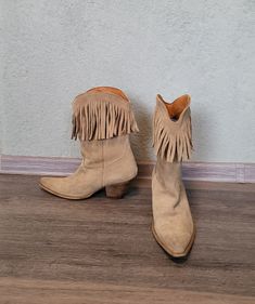 Suede leather upper women`s tan brown or beige western cowboy fringed boots. Size US 8, EUR 39. Chunky cowgirl embroidered boots with chunky low heels and pointy toes.   Women`s western frontal surface embroidered cowboy calf boots. Slip on boots, pull on boots.  Embroidered with brown threads, ornaments. Inside textile lining.  Made in Portugal. Spring, summer and fall autumn boots. Cowboy lifestyle dancing footwear.  brand: Pepe Jeans condition: great surface, used a little bit, has some sligh Western Suede Moto Boots For Ranch, Western Suede Moto Boots For Rodeo, Western Style Closed Toe Mid-calf Boots For Winter, Western Style Mid-calf Boots With Closed Toe For Winter, Western Suede Moto Boots With Snip Toe, Leather Fringe Boots For Rodeo, Bohemian Suede Boots With Fringe, Bohemian Suede Winter Boots, Bohemian Winter Suede Boots