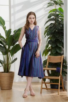 This blue summer dress is a blend of elegance and practicality, perfect for both casual wear and special occasions like tango events or milongas. Crafted from colorful striped cotton, this dress is as vibrant as it is comfortable. The polka dot cotton belt adds a playful contrast and allows you to define your waistline effortlessly. The wrap design ensures a comfortable fit and pockets offers practicality for carrying small essentials. With its graceful silhouette and unique style, this dress is a standout choice for dancers or anyone looking for a versatile yet chic outfit. Size: M Chest: 84-86 cm Waist: 68-70 cm Hip: 92-94 cm Dress length 108 cm from tip of shoulder to bottom. Delicate hand wash or dry clean. Summer Cotton Belted Dress With Tie Waist, Blue Belted Summer Dress, Striped Belted Summer Dress, Belted Striped Summer Dress, Striped Belted Dress For Summer, Striped Summer Dress With Tie Waist, Summer Striped Dress With Tie Waist, Purple Summer Dress With Tie Waist, Summer Purple Dress With Tie Waist