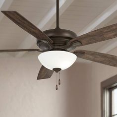 a ceiling fan with two wooden blades hanging from it's center and one light on top