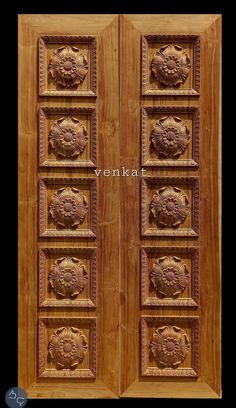 two wooden doors with carved designs on them