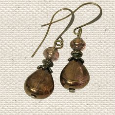 Bronze translucent Czech glass teardrop beads and shell shaped beaded earrings. Beautiful natural earthy tones and depth of color. Great teardrop earrings for everyday wear or for dress up, for the office or a night on the town.  These handmade minimalist dangle earrings are a versatile accessory and will look great with all your neutral clothing as well as any shade of brown clothing and compliment many other colors. I love browns with turquoise, red, coral, orange and more! Custom ear wire sty Elegant Copper Teardrop Earrings, Copper Beaded Teardrop Earrings, Beaded Copper Teardrop Earrings, Copper Teardrop Beaded Earrings, Adjustable Teardrop Bronze Earrings, Copper Beaded Teardrop Earrings For Gifts, Vintage Teardrop Beaded Earrings For Jewelry Making, Vintage Beaded Teardrop Earrings, Vintage Teardrop Beaded Earrings Nickel Free