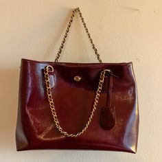 Used 3 Times. Looks Brand New. Burgundy/Maroon Color With Gold Hardware And Chain. Chic Burgundy Shoulder Bag With Detachable Handle, Classic Bag With Chain Strap And Double Handle, Chic Burgundy Shoulder Bag, Evening Burgundy Satchel With Gold-tone Hardware, Chic Burgundy Shoulder Bag With Double Handle, Luxury Burgundy Shoulder Bag For Everyday Use, Burgundy Travel Bags With Gold-tone Hardware, Elegant Tote Bag With Chain Strap, Formal Burgundy Shoulder Bag With Double Handle