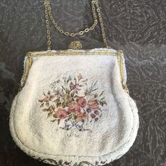 (eBay) Antique Micro-Beaded Victorian Floral Tapestry Purse Bag Clutch Metal. Approx 6 x 6 1/2 Please see photos for more accurate description and condition. Has some discoloration, did not try to clean. Victorian Era Objects, Cottage Core Purse, Formal Embroidered Tapestry Bag, Handmade Tapestry Evening Bags, Handmade Tapestry Bags For Evening, Vintage Embroidered Tapestry Shoulder Bag, Embroidered Tapestry Rectangular Shoulder Bag, Embroidered Tapestry Bag In Rectangular Shape, Vintage Beaded Bag