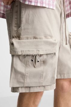 WASHED CARGO SHORTS - Stone | ZARA United States Utility Bermuda Bottoms With Built-in Shorts, Utility Bermuda Shorts With Built-in Shorts, Casual Streetwear Shorts With Multiple Pockets, Casual Relaxed Fit Cargo Pants With Built-in Shorts, Utility Shorts With Drawstring For Streetwear, Utility Style Drawstring Shorts For Streetwear, Utility Drawstring Shorts For Streetwear, Urban Style Short Length Bottoms With Cargo Pockets, Casual Streetwear Shorts With Pockets