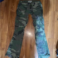 Size Xs Abercrombie Camo Cargo Style Pants. Small Amount Of Wear On Back Of Bottom Hem(Can Be Seen In Last Pic). Rare Hard To Find Y2k A&F Pants Measurements 15” Across Waist 7 1/4” Rise 32” Inseam Size Xs 90s, 00s, 1990s, 2000s, Y2k, Butterfly, Chunky, Slouchy, Elle Woods, Legally Blonde, Blair Waldorf, Gilbert, Bella Swan, Fairy Core, Fairy Grunge, Twilight, Vampire, Vintage, Hollister, Abercrombie & Fitch, Free People, Lace, Embroidered, Pretty Little Liars, Urban Outfitters, Cargo, Low Rise, Flare Fitted Camouflage Military Pants, Fitted Camouflage Pants With Cargo Pockets, Fitted Camouflage Cargo Pants, Fall Camouflage Mid-rise Pants, Fitted Camouflage Pants For Fall, Fitted Full Length Camouflage Pants, Fitted Camouflage Cargo Trousers, Vampire Vintage, Urban Outfitters Cargo